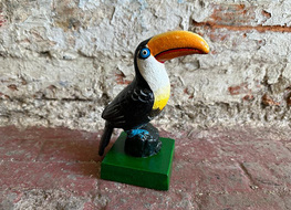 toucan figure on base